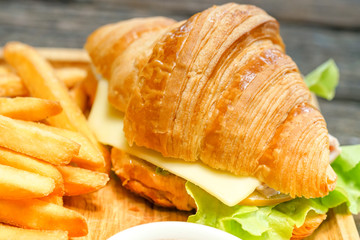Croissant ham cheese delicious breakfast on wooden table