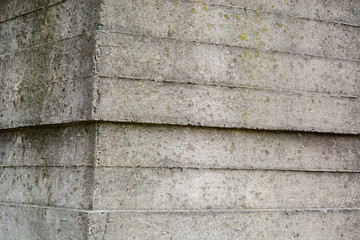 An old surface of concrete with impressions of rough boards. Gray industrial background. Copy space.