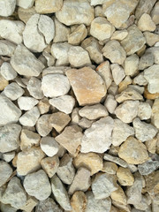 white stones. it is a lot of stones. texture. background.
