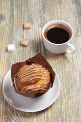 Muffin with cream and coffee