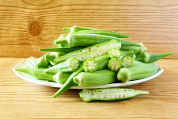fresh okra vegetable in wooden table background