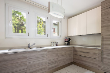Modern kitchen with wood and a window where a lot of light enters