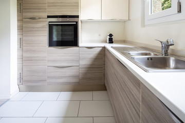 Modern kitchen with wood and a window where a lot of light enters