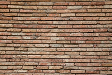 Фрагмент старинной каменной стены серого цвета.горизонтально.