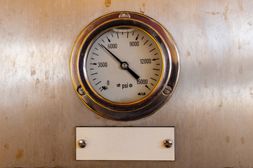 Pressure gauge or pressure indicator reading five thousand pressure square inch (psi)  in offshore oil and gas refinery process operation industry.