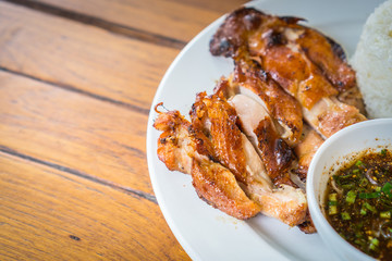 Grilled chicken cut into pieces on a white plate