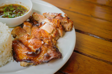 Grilled chicken cut into pieces on a white plate
