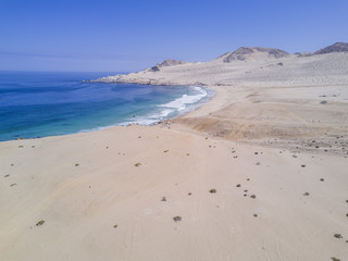 Atacama Desert has amazing beaches like this one called "Cifuncho" in Taltal town at Antofagasta region, Chile. An aerial view of the beach with the drone