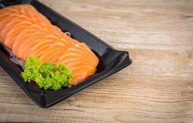 Salmon raw sashimi on wooden table background, japanese food