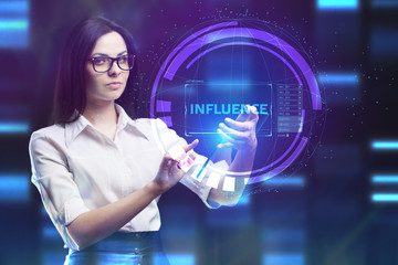 The concept of business, technology, the Internet and the network. A young entrepreneur working on a virtual screen of the future and sees the inscription: Influence