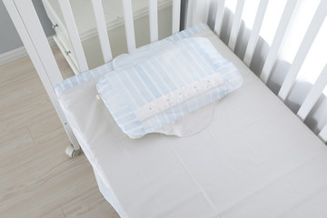 Fototapeta na wymiar The image of child's bed under the white background