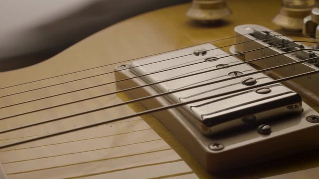 Guitar Strings Vibrating in Slow Motion Slider Macro Shot