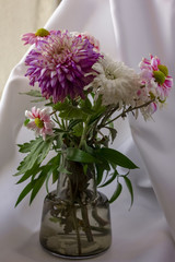 A vase of flowers isolated on white