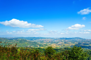 Panoramic view mountain range on Nature Trail in Khao Kho National Park in Phetchabun,Thailand, blue sky background texture with white clouds