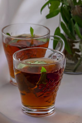 Fototapeta na wymiar Two glasses of tea with mint