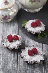 Raspberries cake dessert tea spoon teapot table.