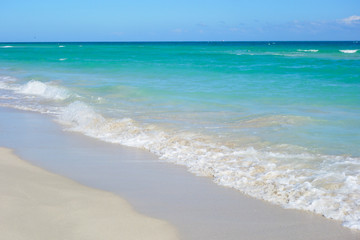 Fototapeta na wymiar White sandy beach and azure sea.