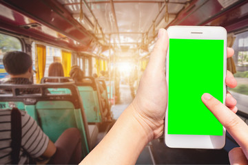 Use smartphone blurred images touch of World figure in Abstract inside the bus with passengers Blurred background