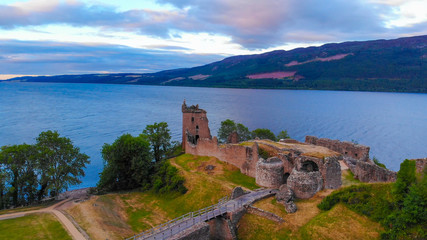 Fototapeta na wymiar Loch Ness and Urquhart Castle in the evening - aerial view