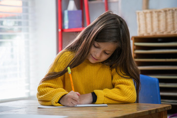 Girl in classroom at Montessori school