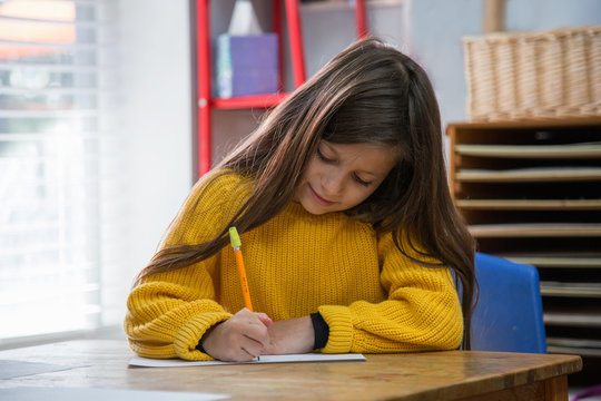 Girl in classroom at Montessori school