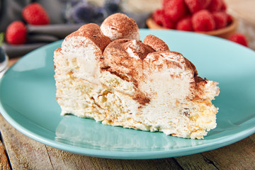 Triangular Slice of Tiramisu with Coffee, Mascarpone Cheese and Cocoa