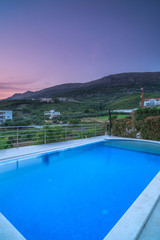 Villa with pool in mountains at sunset,long exposure