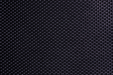 Black dense fabric macro bag backpack background