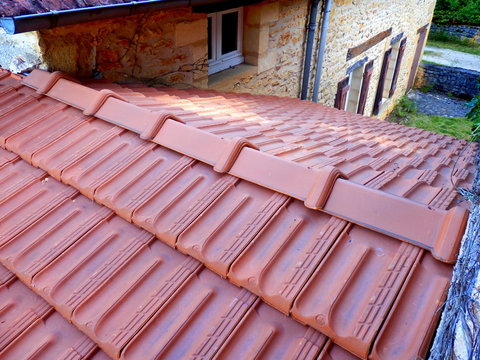 New roof tiles installed following replacement of old terracotta roof tiles