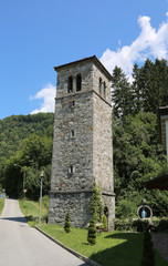 Fototapeta na wymiar stone bell tower of a village in the mountains