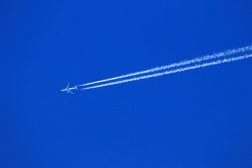 Plane with chemtrails or condensate trace