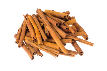 Pile of cinnamon sticks isolated on white background
