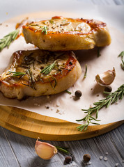 meat grilled rosemary spices wooden background
