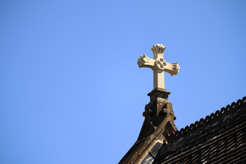 Fototapeta na wymiar Religious cross on church roof