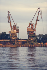 Vintage retro cranes in the port.