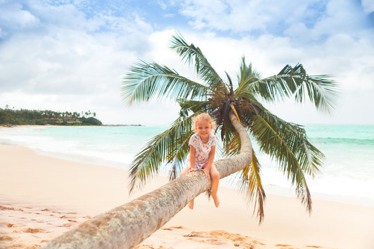 girl on palm tree