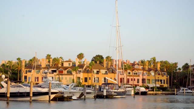 Golden hour at the marina of Sotogrande. A luxurious place to live ar go on vacations if you have a big yacht. Very luxorious location where you can see amazing yachts, colorfull houses and nice cars.