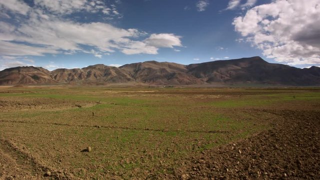 Timelapse of mountain landscape with field Tibet