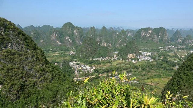 Scenic countryside with karst hills from the summit of Moon Hill of Yangshuo county. Guilin, Guangxi Zhuang, China 