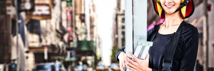 Composite image of female architect holding ladder against white