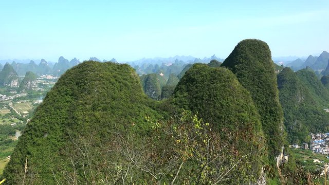 Scenic countryside with karst hills from the summit of Moon Hill of Yangshuo county. Guilin, Guangxi Zhuang, China 