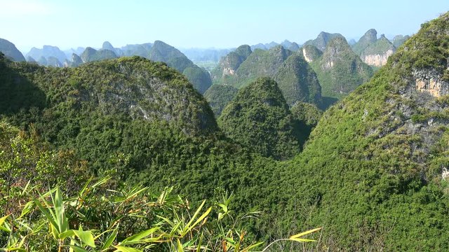 Scenic countryside with karst hills from the summit of Moon Hill of Yangshuo county. Guilin, Guangxi Zhuang, China 