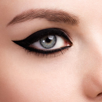 Beauty makeup for blue eyes. Part of beautiful face closeup. Perfect skin, long eyelashes. Make up concept.