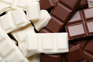 White and brown chocolate pieces background