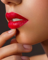 Red Sexy Lips and Nails closeup. Open Mouth. Manicure and Makeup. Make up concept. Kiss