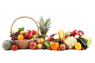 Ripe fruits and vegetables on white background