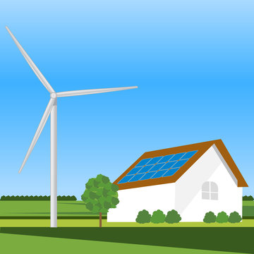 Eco residential family house with wind turbine.