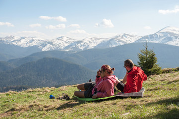 travelers who are resting in the mountains