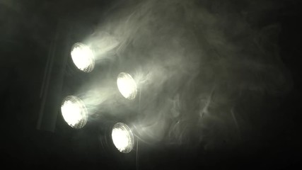 Searchlights with flickering light create color music