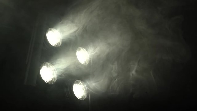 Searchlights with flickering light create color music